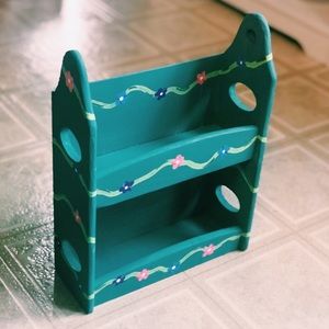 Hand-painted wooden shelf with flower design
